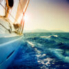 Yacht Sailing against sunset.Sailboat.Sepia toned